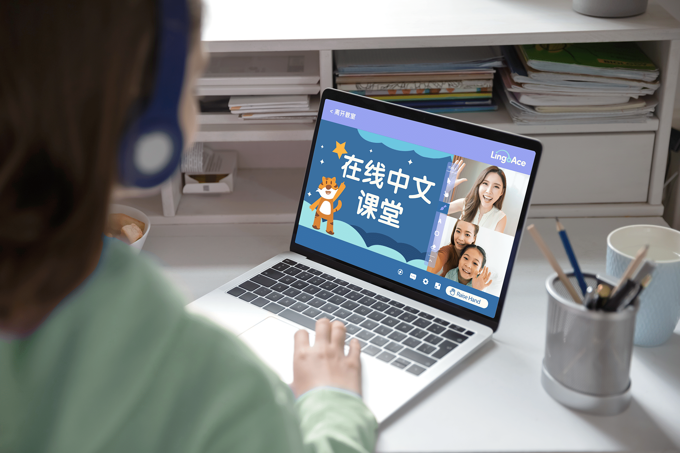 A girl interacting with her teacher in an online Chinese class